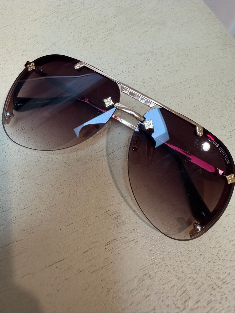 Louis Vuitton Women’s Rimless Aviator Sunglasses in Dark Gradient Brown